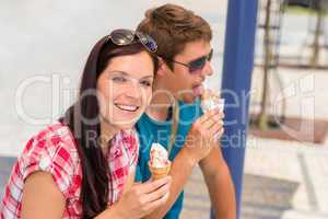 Young woman and man eat ice cream