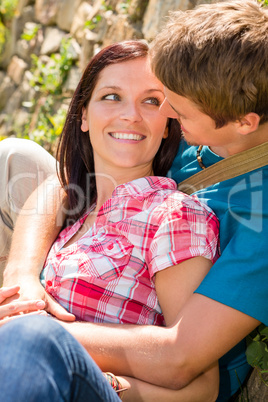 Young loving couple outdoors look each other