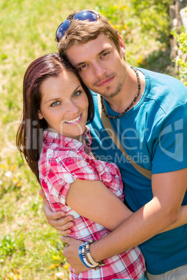 Happy affectionate young couple hugging in park