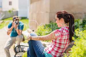 Young man take photo of his girlfriend