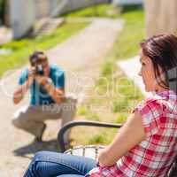 Young man take photo of his girlfriend