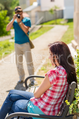 Young man take photo of his girlfriend