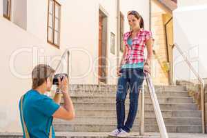 Young couple in city take photos