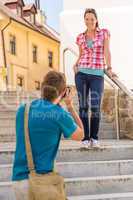 Young couple in city take photos