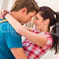 Young loving couple embracing and smiling romance