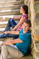 Young couple relax on stone stairs romantic