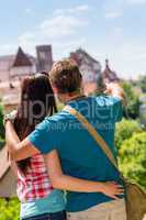 Young man pointing woman the castle architecture