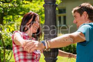 Happy young lovers have fun in park