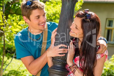 Couple smiling at each other in park