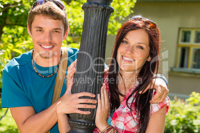 Happy young lovers smiling
