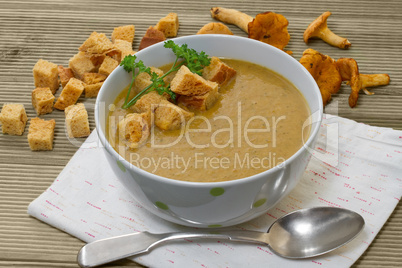Chanterelle soup puree served with croutons