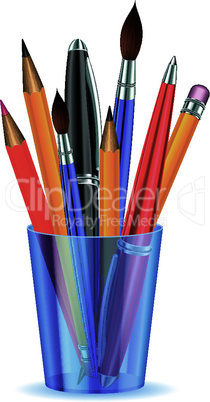 Brushes, pencils and pens in the holder.