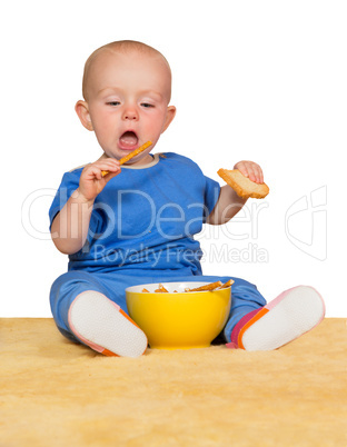 Little baby eating biscuits