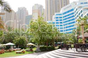 Green lawn and building of luxury hotel, Jumeirah, Dubai, UAE