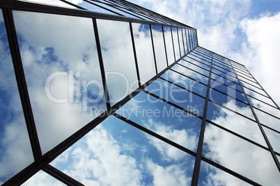 reflecting clouds in glass facade