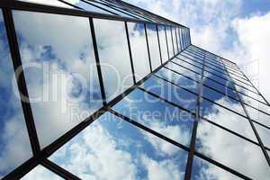 reflecting clouds in glass facade
