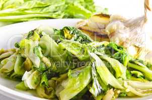 baked Romaine lettuce with garlic and pine cores