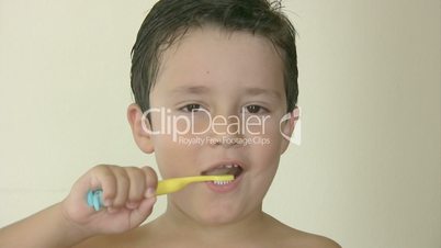 Child brushing his teeth