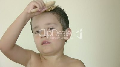 Child brushing his hair