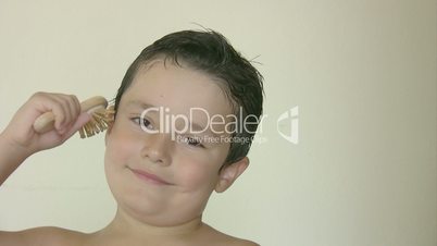 Child brushing his hair