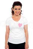Woman with pink paper heart on her t-shirt