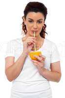 Active fit girl drinking fresh orange juice