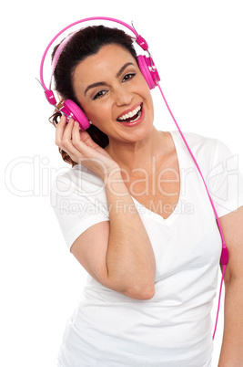 Young smiling woman listening to music