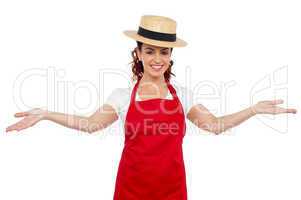 Pretty chef welcoming you with her arms stretched