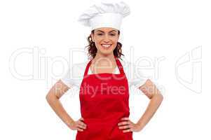 Cure female chef posing with hands on her waist