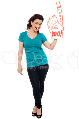 Woman cheering with large boo hurray foam hand