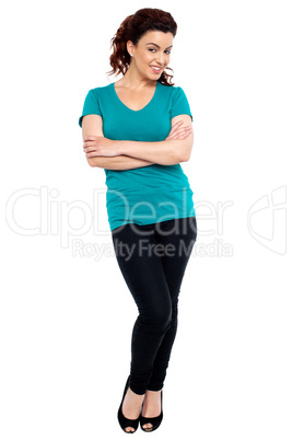 Cheerful woman posing with her hands crossed