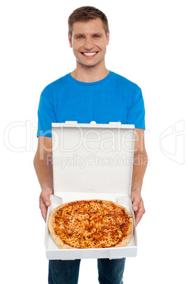 Smiling man offering pizza to you