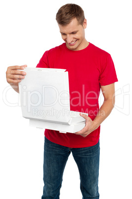 Hungry man looking at delicious yummy pizza