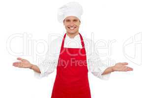 Joyful chef welcoming his guests