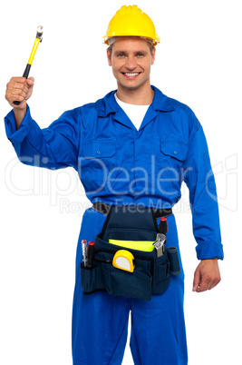 Smiling young repairman holding hammer