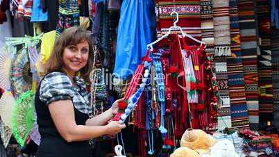 Woman Chooses Folk Ornaments