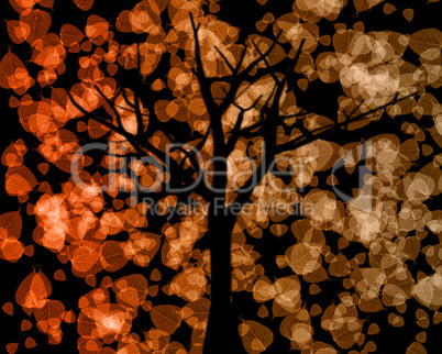 Tree Silhouette with Autumn Leaves Background