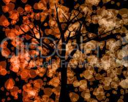 Tree Silhouette with Autumn Leaves Background