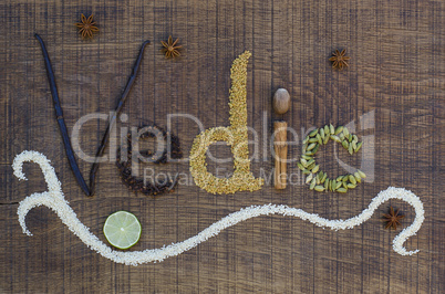 the word vedic spelled out in ayurveda spices and seeds on a woo