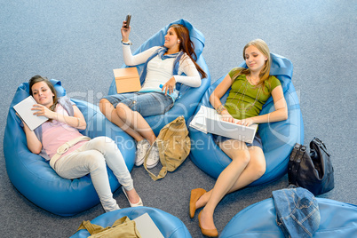 Group of students lying on beanbag relax