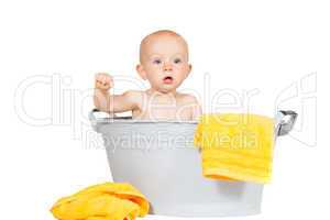 Adorable baby in a zinc bath
