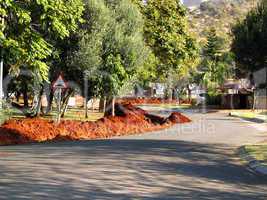 Speed-bump sign with large sand heaps