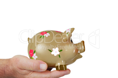 Hand holding piggy bank