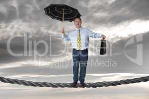 Business man balancing on the rope