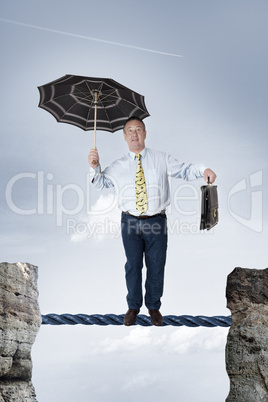 Business man balancing on the rope