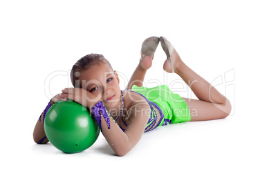 Kid lay with gymnastic ball isolated