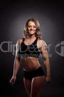 Young athletic woman body builder portrait