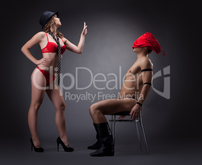woman undress red cloth before nude man