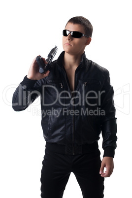 Security officer in black leather with shotgun