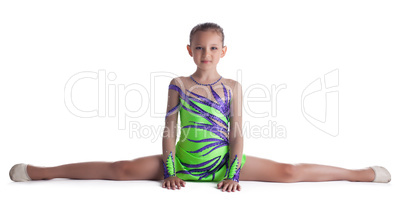 Kid gymnast doing split in green costume